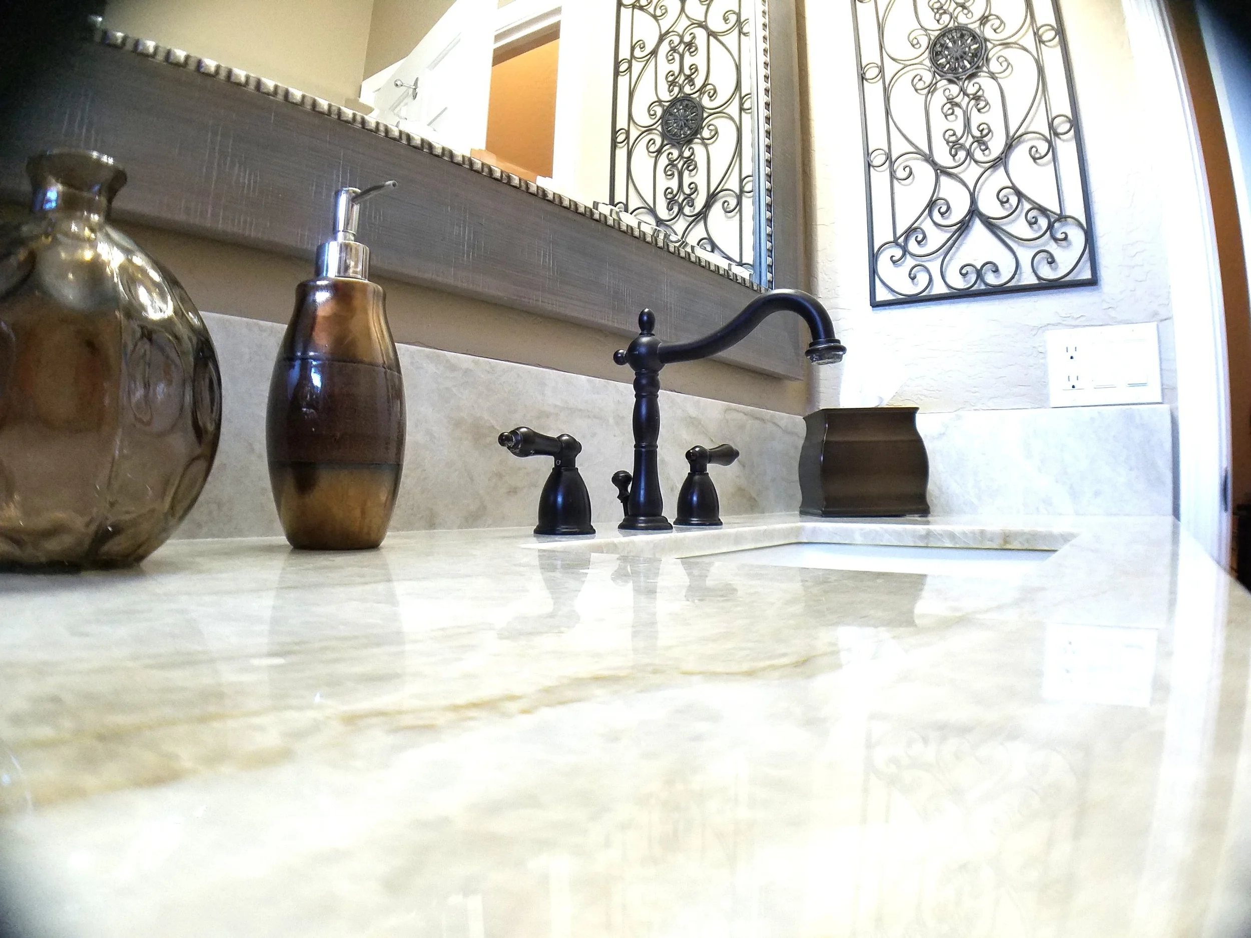 Quartzite bathroom vanity top with an oil-rubbed bronze faucet