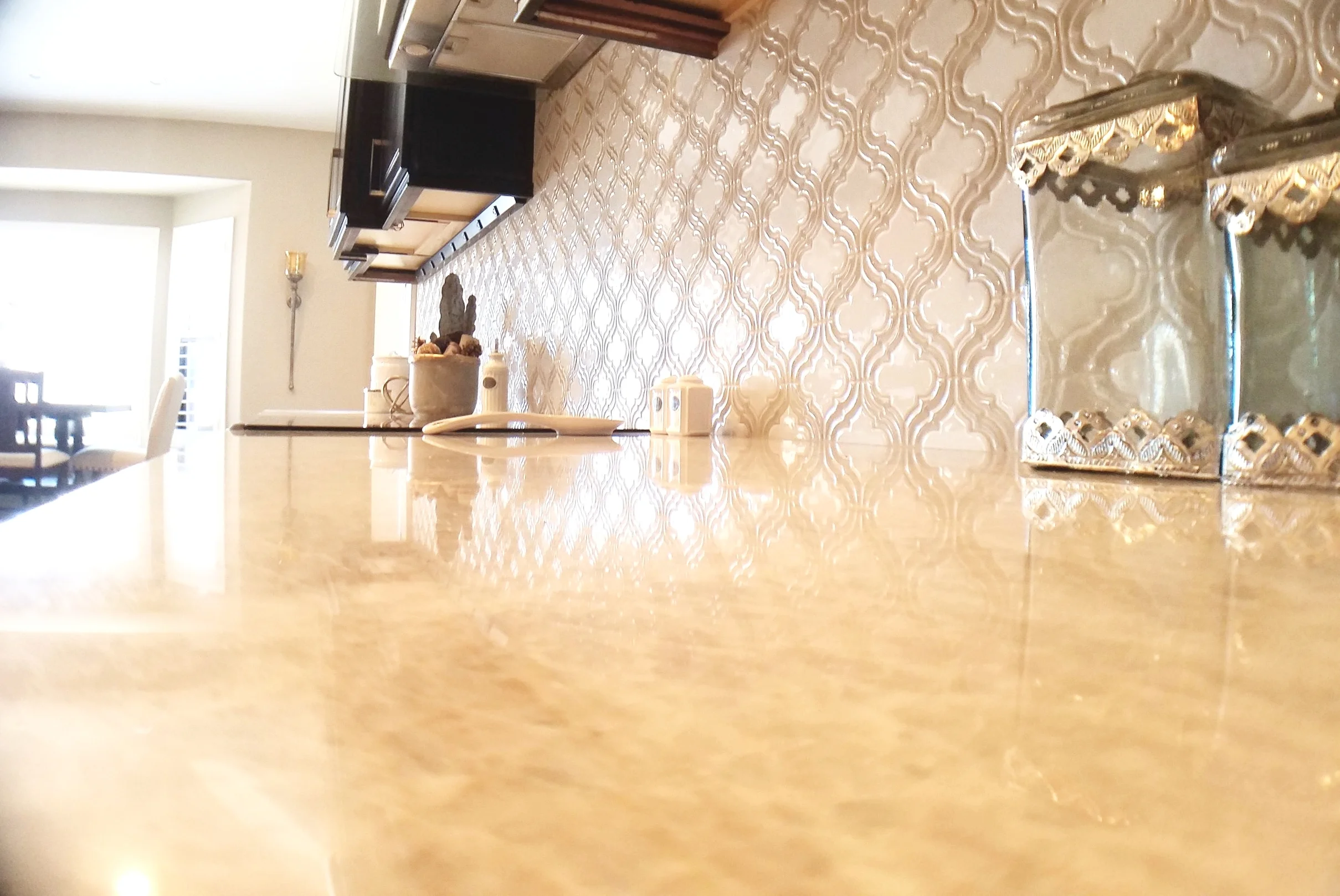 Wide view of the finished espresso kitchen showing the island seating and the run of perimeter cabinets